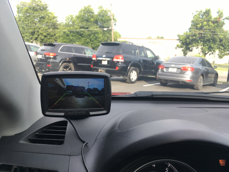 Mounted to a texturized dashboard.